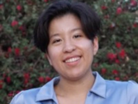 Decorative image of Anika Arias smiling. 