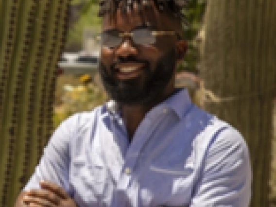 Decorative image of Ateh Zinkeng smiling. 