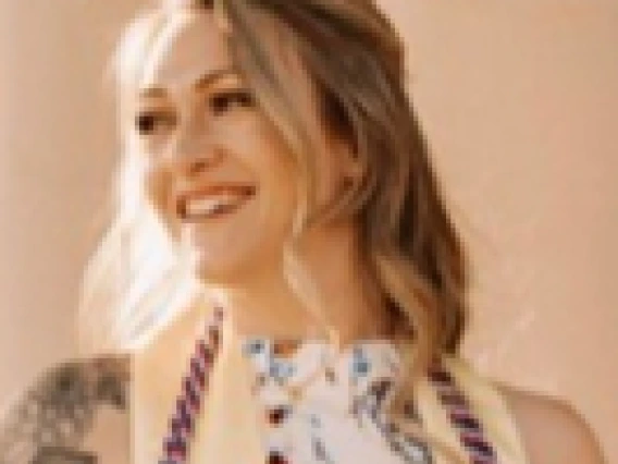 Decorative image of Caitlyn Flores smiling. 
