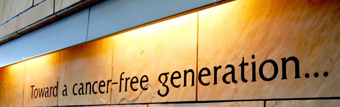 Wall inscribed with words "Toward a cancer-free generation"