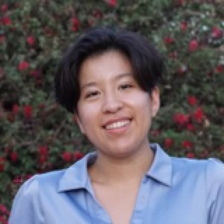 Decorative image of Anika Arias smiling. 